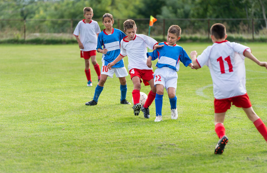 22428788-little-kids-playing-defense-in-football-match-Stock-Photo-soccer