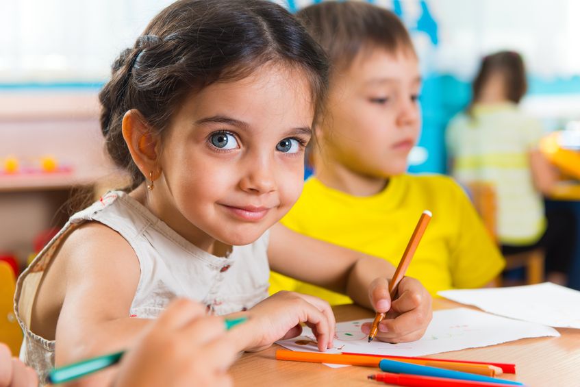 20085568-Group-of-cute-little-prescool-kids-drawing-with-colorful-pencils-Stock-Photo