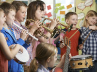 44634338-Group-Of-Students-Playing-In-School-Orchestra-Together-Stock-Photo