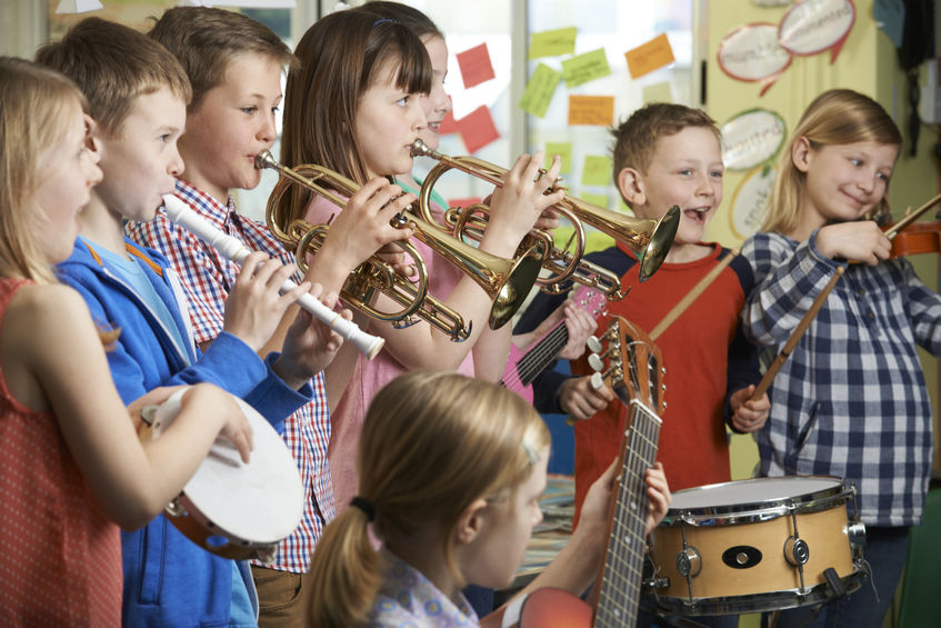 44634338-Group-Of-Students-Playing-In-School-Orchestra-Together-Stock-Photo